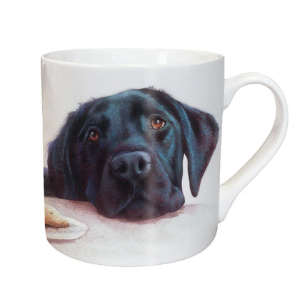 The Otter House Dog Mug Black Labrador is a white ceramic mug featuring an illustration of a Black Labrador resting its head and gazing up with soulful eyes.