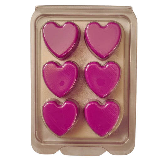 a wax melt bar in clamshell with 6 bright pink hearts