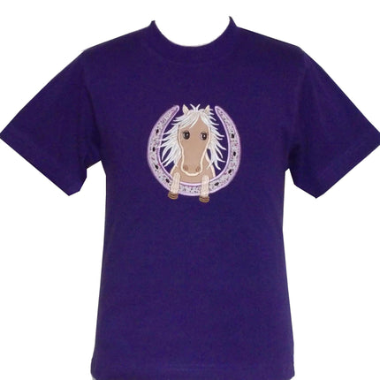 Purple t-shirt with an illustration of a horses head inside a horseshoe on the front. The horse has a light mane and big eyes, and the horseshoe is decorated with small star patterns.