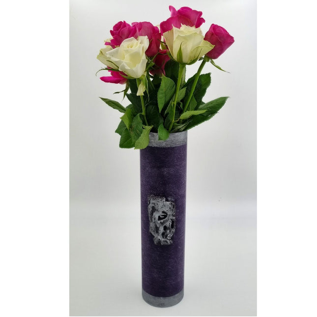 The Quaver&Lyric Wax Vase Tall Cylinder in purple with an aged silver effect holds pink and white roses with green leaves, creating a stunning home decor piece against a plain white background.