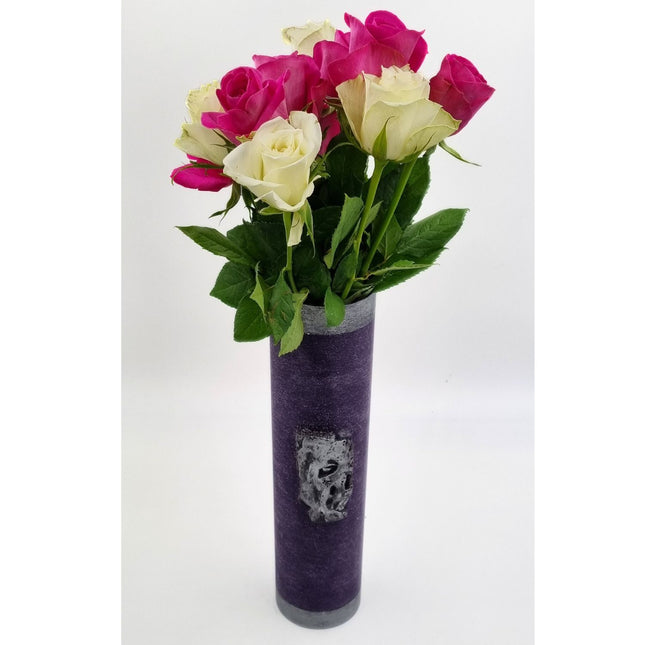 The Quaver&Lyric Wax Vase Tall Cylinder Purple with Aged Silver Effect displays pink and white roses with green leaves against a plain white background—a striking home decor accent.