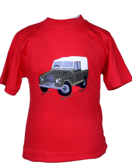 The Ramblers Embroidered T Shirt Farm Vehicle Childrens is a red short-sleeve tee with a green and white vintage farm vehicle designâ€”an adventurous pick for any kidâ€™s wardrobe.