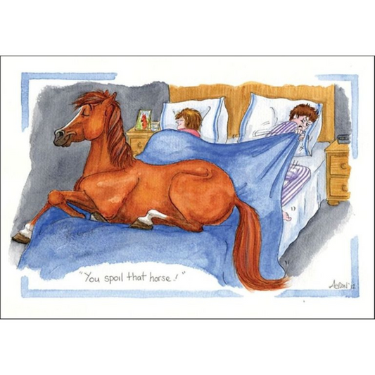 a cartoon of a chestnut horse comfortabl snuggling on a bed with the caption you spoil that horse