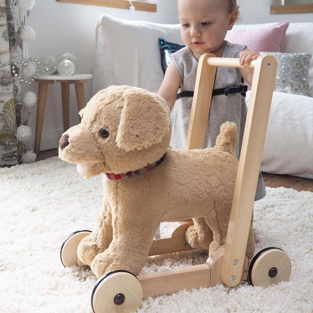 a baby playing with an adorable golden labrador soft toy puppy dexter dog infant push aong walker by Little Bird Told Me