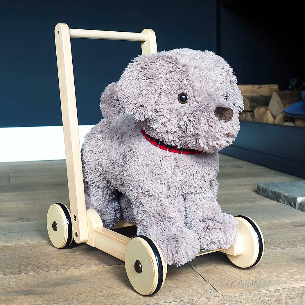infant walker an adorable grey furred toy dog on a wooden push along frame in a room setting