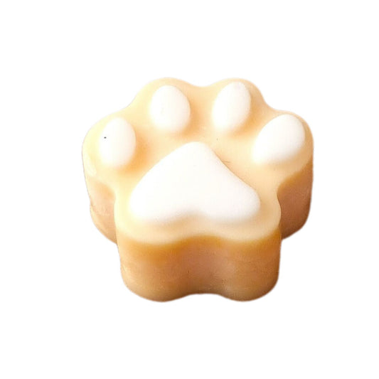 an orange Soy Wax Melt Paw Shaped with white pads