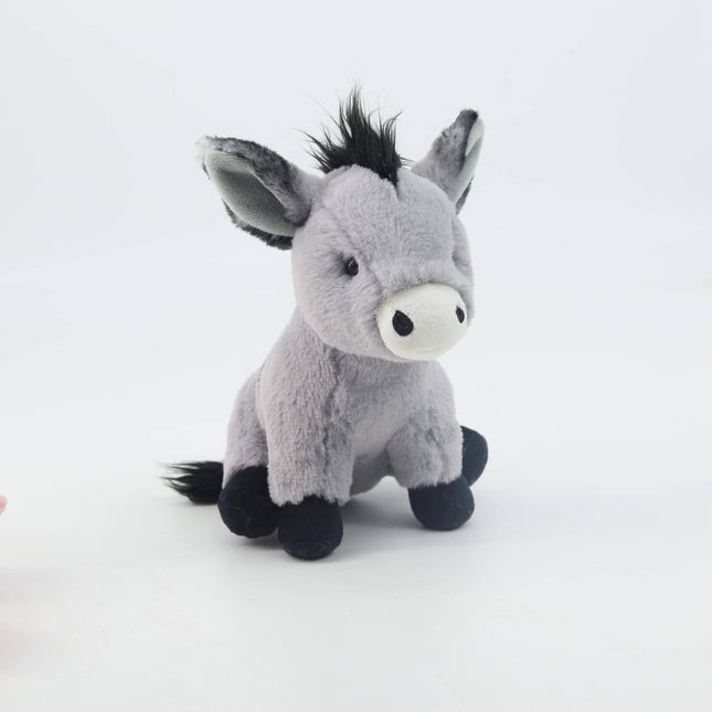 the front view of a grey soft toy donkey with white muzzle, black mane, tail and hooves