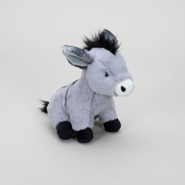 the side view of a grey soft toy donkey with white muzzle, black mane, tail and hooves