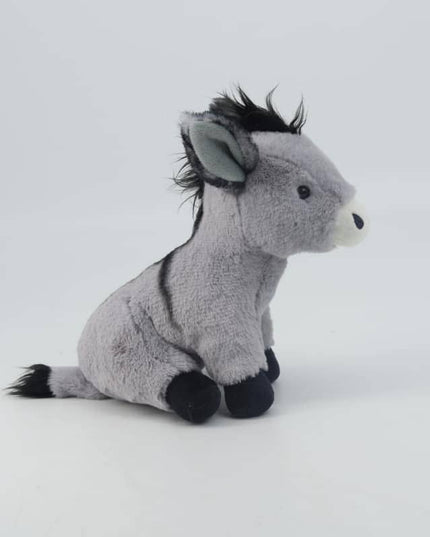 the side view of a grey soft toy donkey with white muzzle, black mane, tail, shoulder stripe and hooves
