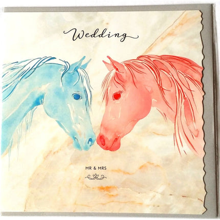 The Equestrian Wedding Greeting Card by Deckled Edge Ltd features Janna Cossettinis watercolor blue and pink horses with Wedding and Mr & Mrs on a marbled background—a unique horse-themed card.