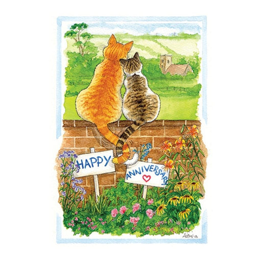 a happy anniversary card featuring a cartoon drawing of two cats sitting on a garden wall looking at the view of a church in the distance. The cats are snuggling up to each other and their tails are entwined