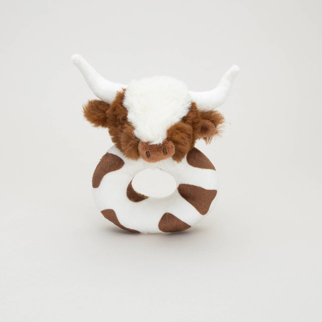 a soft plush circular brown and white baby rattle with a fluffy brown and white longhorn cow head