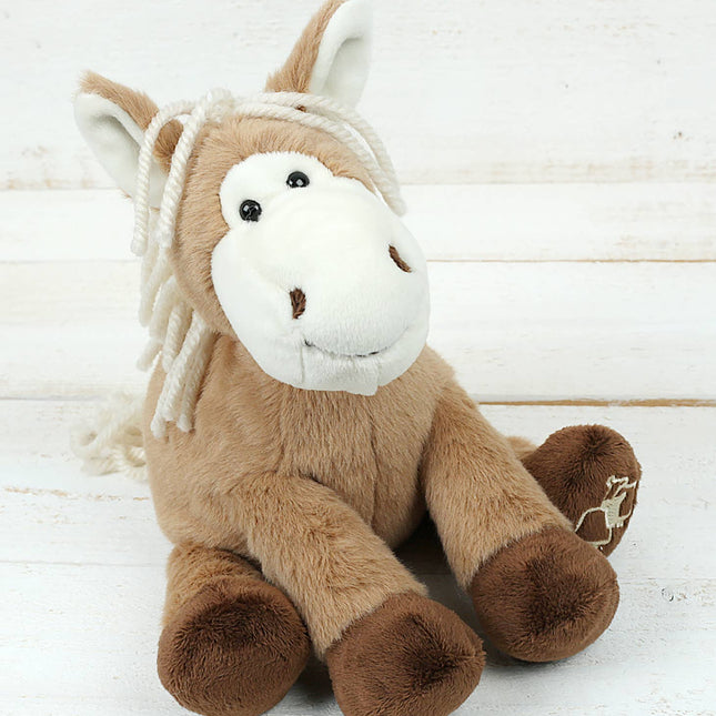 a soft and fluffy brown fabric pony Soft Toy with a smiley face, white mane and tail, and dark brown hooves,