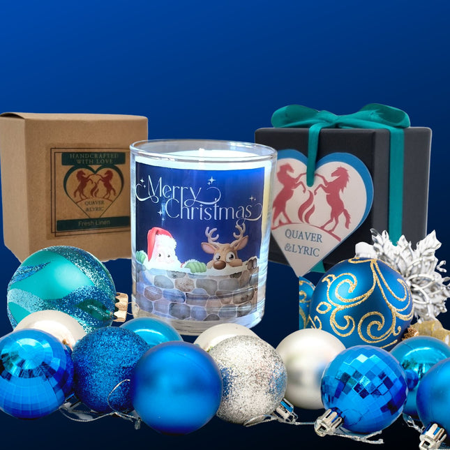 A Christmas scented candles with a charming Merry Christmas design featuring Father Christmas and a reindeer peeping over a wall.The candle is next to a kraft box and a luxury gift box.
