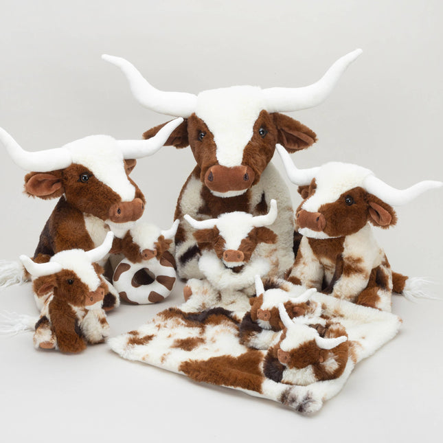 Texas Longhorn Cow Slippers For Infants from Jomanda Soft Toys & Accessories, featuring brown and white plush fur with big white horns, are grouped with the rest of the longhorn cow range perfect as a cute baby gift or cozy inspiration.