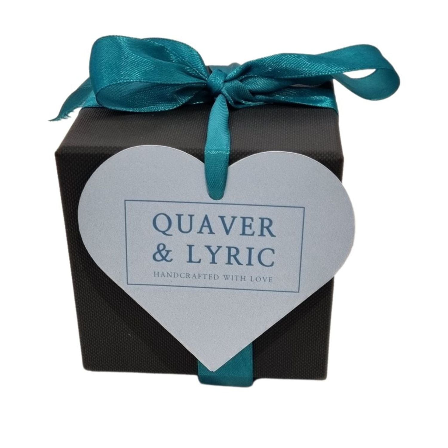 black Gift Box with teal coloured ribbon and bow and quaver and lyric teal gift tag