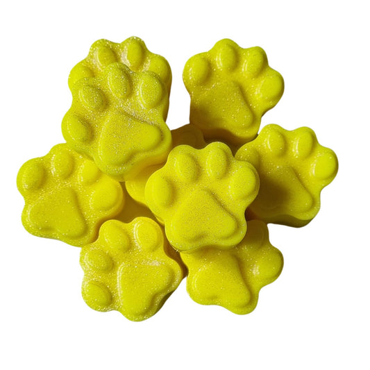 a group of bright yellow paw shaped wax melts