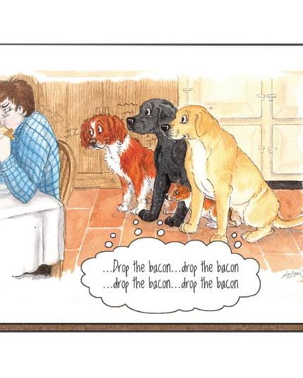 Coaster featuring a cartoon of a grumpy man in his kitchen eating a bacon sandwich with three dogs sitting down eagerly looking at him. Thought bubble reads "drop the bacon.. drop the bacon" 
