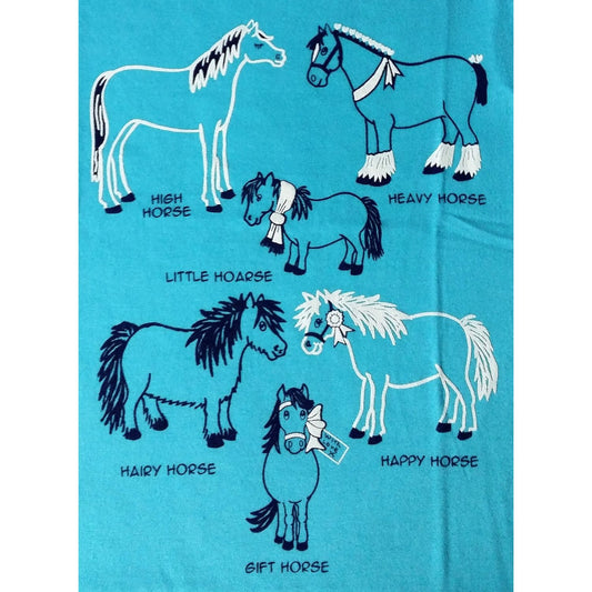 The Horse T Shirt Printed Azure Blue Childrens by British Country Collection showcases six quirky cartoon horsesâ€”High Horse, Heavy Horse, Little Hoarse, Hairy Horse, Happy Horse, and Gift Horseâ€”ideal for kids who love humor and unique designs.