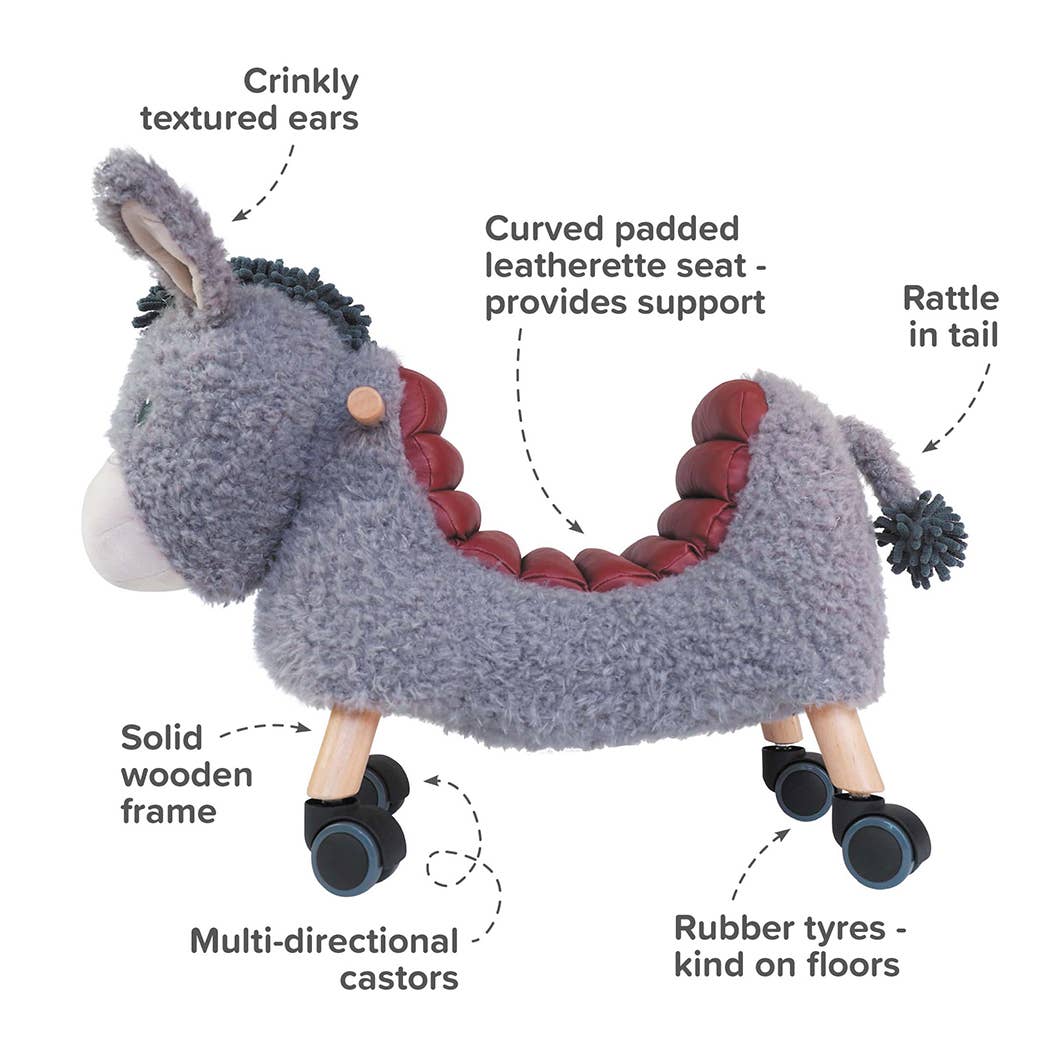 an image of the donkey ride on toy highlighting its features crinkle ears, curved seat, rattle in tail, rubber tyres, multi directional castors and wooden frame