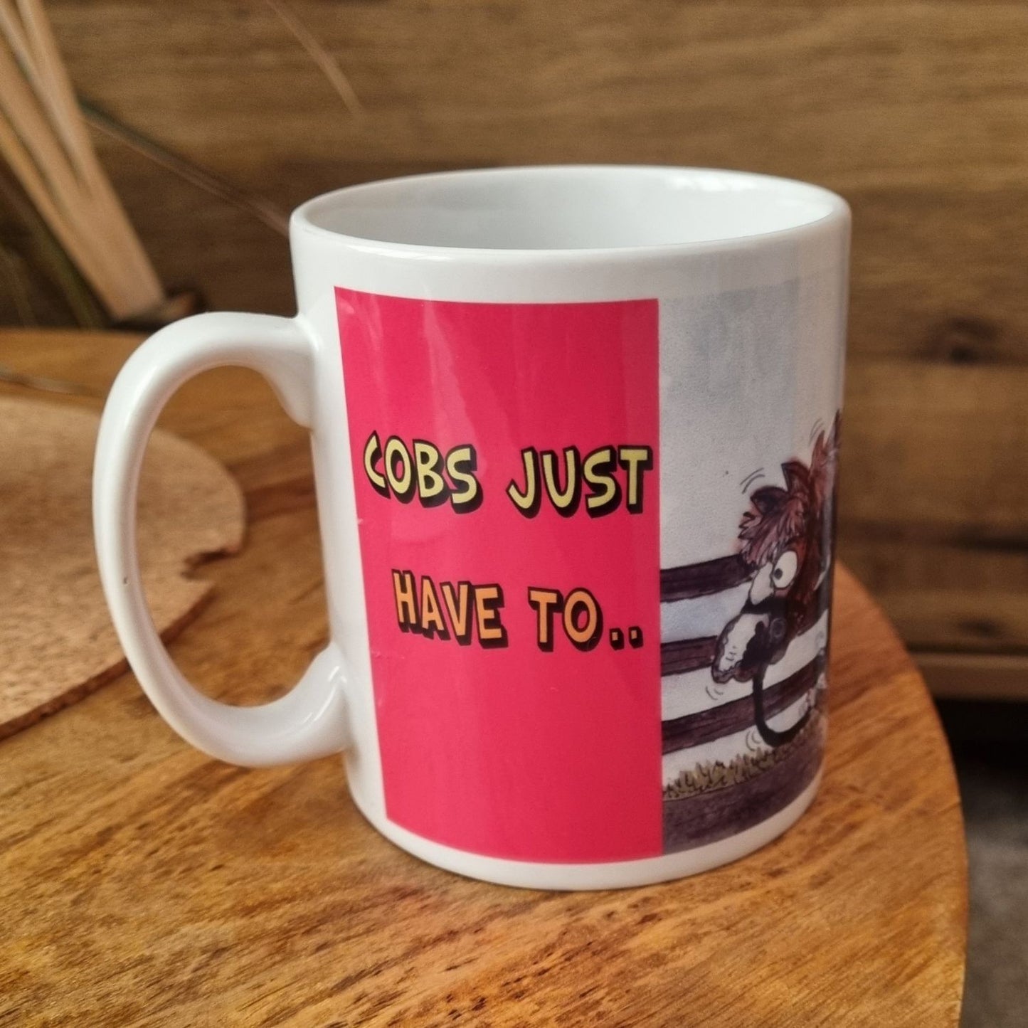 a mug showing a coloured cob horse walking over its owner