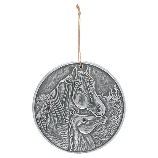  a silver coloured plaque showing a horse with feathers and plaits with its foal