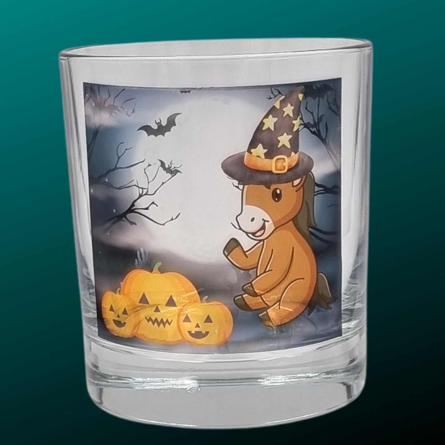 an empty halloween tealight holder with a cute cartoon pony and pumpkin design