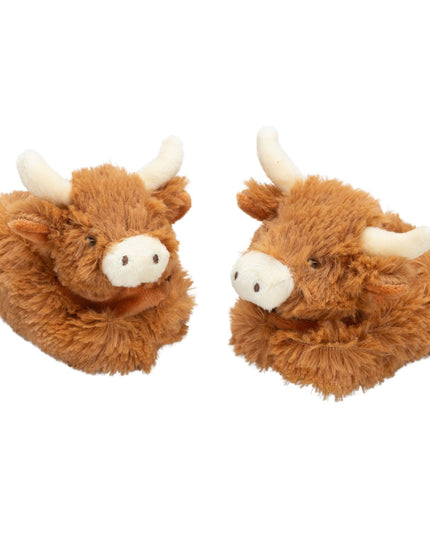 a pair of fluffy brown baby boots featuring cute highland cow heads with cream nose and horns