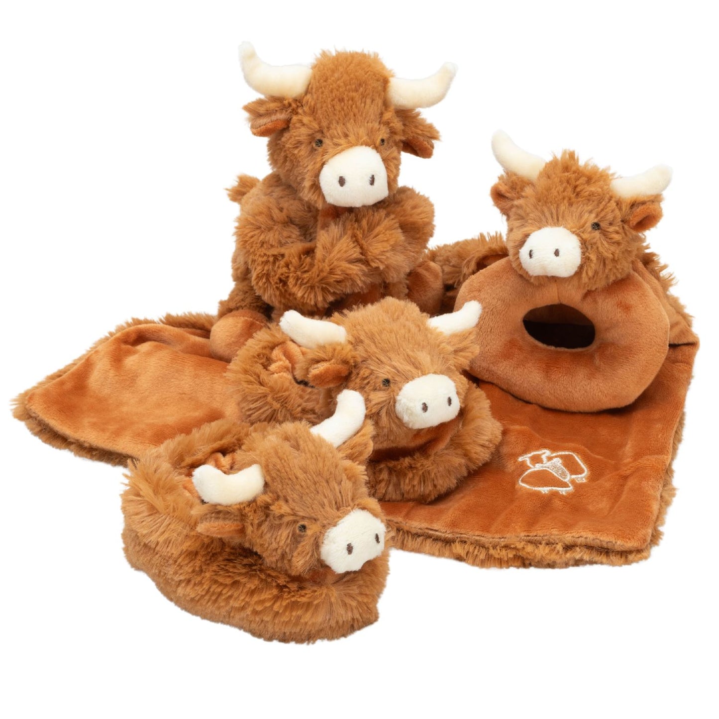 a group of highland cow baby products including a soft toy and comfort blanet, a soft fabric rattle and a pair of fluffy booties.