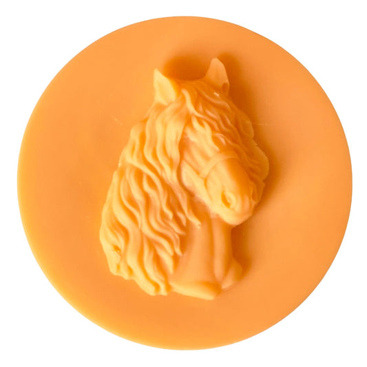 An orange coloured disc made of wax with a matching orange wax horses head. The horse has a long mane and forelock.