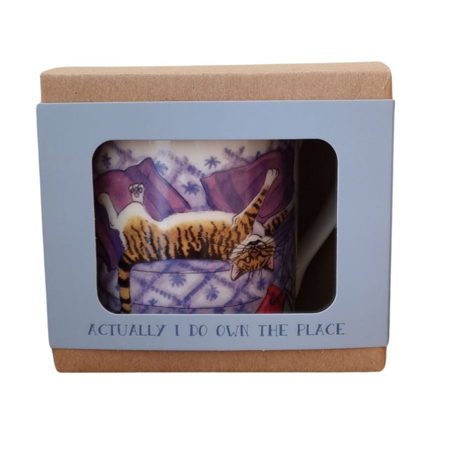 The Alisons Animals Cat and Dog Mug, gift boxed with a window, features a relaxed cat on purple and the phrase ACTUALLY I DO OWN THE PLACE—a perfect novelty gift for cat lovers with attitude.