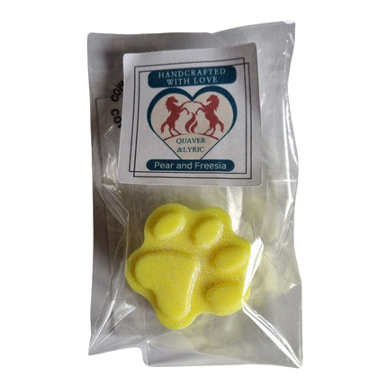 a packet with quaver and lyric rearing horse branding containing a bright yellow Paw Shaped Soy Wax Melt 