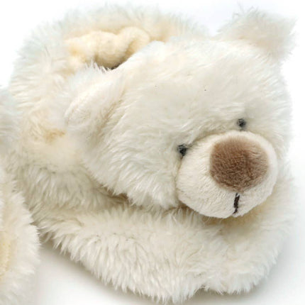 A close-up of Jomanda Soft Toys & Accessories Teddy Bear Slippers For Infantsâ€”cream, soft plush slippers with stitched bear featuresâ€”perfect as a cozy baby shower gift, set against a white background.