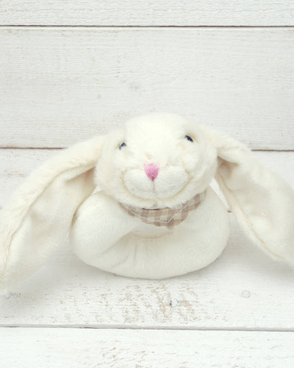 a circular cream plush baby rattle with a cute floppy eared bunny head