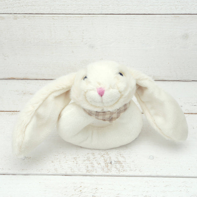 a circular cream plush baby rattle with a cute floppy eared bunny head
