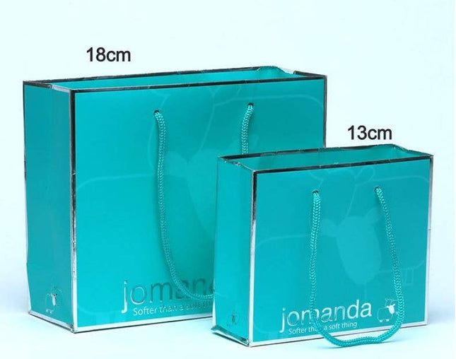 a pair of aqua coloured gift bag with silver jomanda branding with sizes 18cm and 13cm