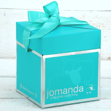 a small teal gft box with silver jomanda branding