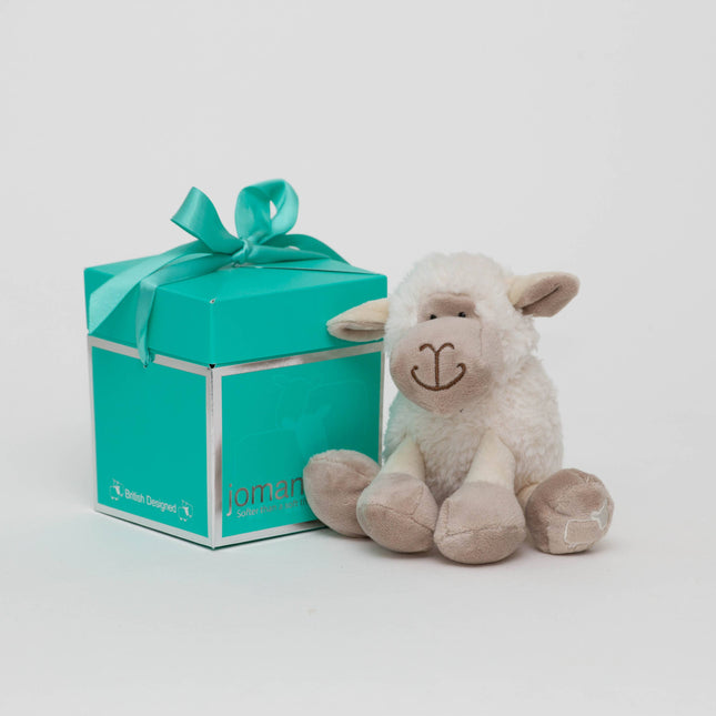 mini sheep soft toy made of very soft white plush fur with beige hooves, and face in soft plush next to a jomanda branded gift box