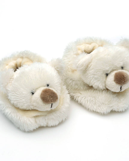 Jomanda Soft Toys & Accessories Teddy Bear Slippers for Infants are cream, soft plush booties with bear faces, brown noses, and stitched smilesâ€”perfect as a newborn gift or cozy baby shower present on a white background.