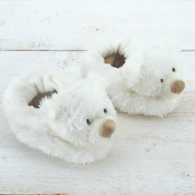 Jomanda Soft Toys & Accessories Teddy Bear Slippers For Infants are cream, soft plush baby booties shaped like bear facesâ€”an adorable baby shower or newborn gift, perfect for keeping tiny feet cozy.