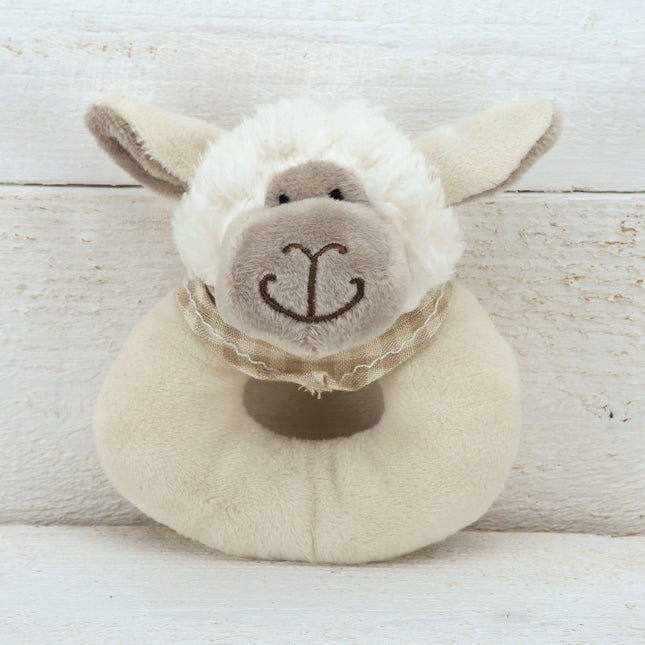 a ring shaped cream plush rattle with a cute sheep head with brown plush nose and checked scarf