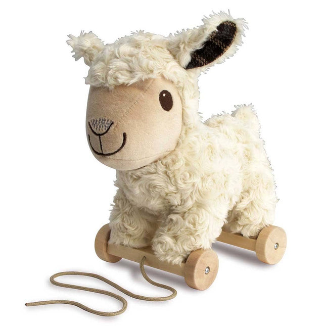 The Little Bird Told Me UK Pull Along Toy Sheep Lambert features cream-colored, curly fur, a smiling face, brown nose, and four wooden wheels with a pull string for tactile stimulation and fun play.