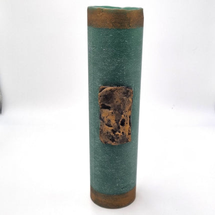 The Quaver&Lyric Wax Vase Tall Cylinder in green features an aged bronze effect with textured bands and a central rectangular patch, making it a stylish accent for your home. Shown against a plain white background.