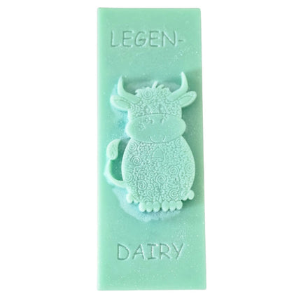 a green Wax Melt bar with highland cow and writing legen....dairy