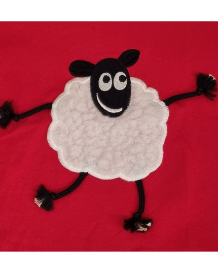 A playful Sheep Embroidered T Shirt Red With Applique Dangly Leg Lamb by Ramblers features a smiling cartoon lamb with rope limbs on a bright red, 100% cotton, machine washable teeâ€”perfect for animal lovers.