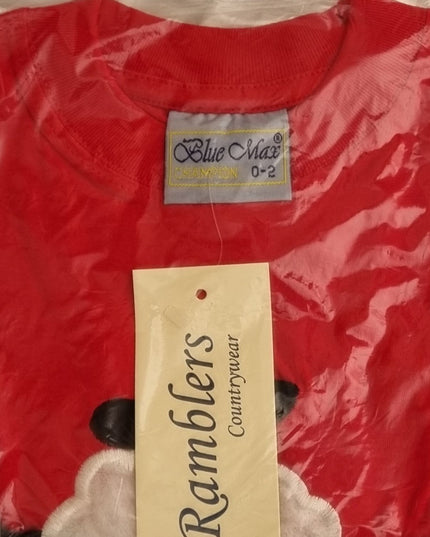 The Ramblers Sheep Embroidered T Shirt in red features an applique dangly leg lamb, made from 100% cotton, size 0-2 (Blue Max label), folded in plastic packaging with a Ramblers Countrywear tag. Machine washable for easy care.