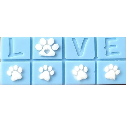 A light blue Scented Wax Melt bar with love and white paw prints