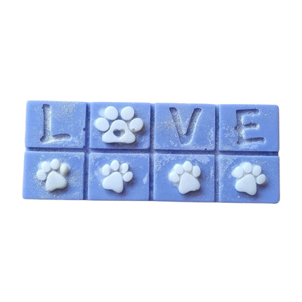 A blue Scented Wax Melt bar with love and white paw prints