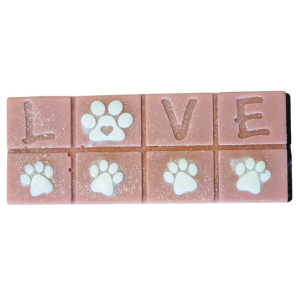 A brown Scented Wax Melt bar with love and white paw prints