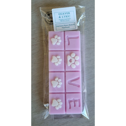 A pink Scented Wax Melt bar with love and white paw prints
